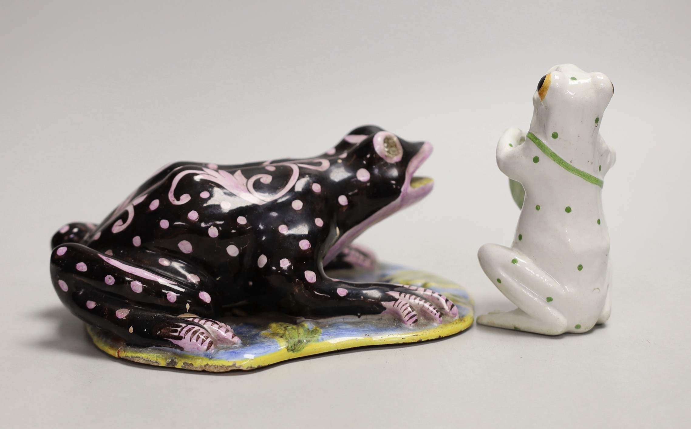 A Masonic faience model of a frog and another, largest 19cm long